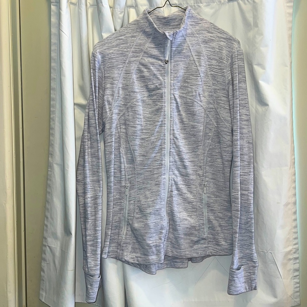 Light-gray women’s Lululemon full-zip jacket.